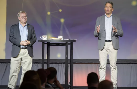 Martin Gren and Fredrik Nilsson on stage presenting during ACCC 2023