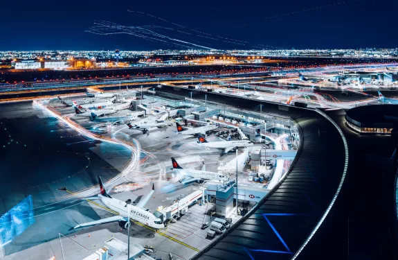 Toronto Pearson Airport at night featuring airplanes at terminal gates