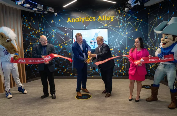 Axis staff and management cutting the ribbon to open the new Dallas-area AEC