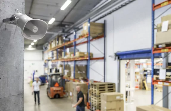 Horn speaker in upper corner of a warehouse