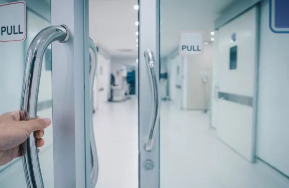 Opening door to hospital cooridor