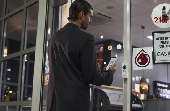 Man walking into gas station