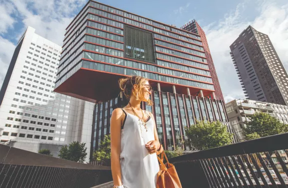 Woman walking pedestrian bridge