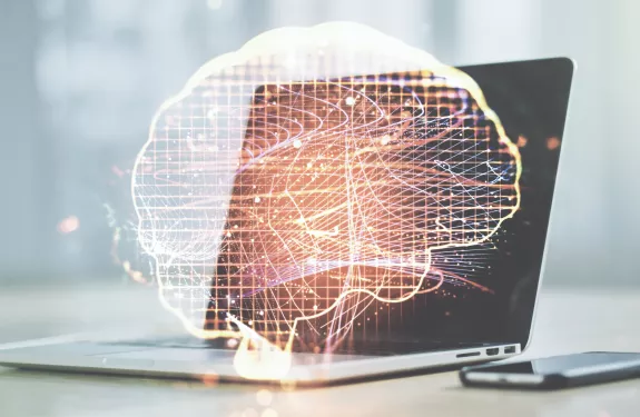 AI Brain in front of laptop