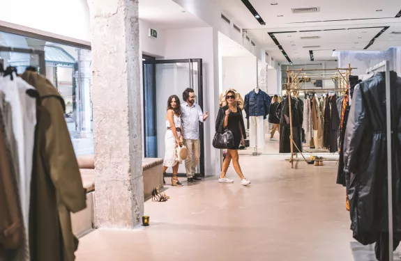 Group entering clothing store that uses modern surveillance technology to reduce retail shrinkage.