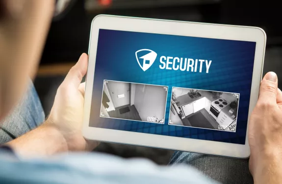 Man holding tablet with security screen