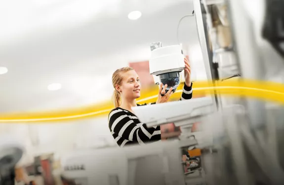 Woman installing camera