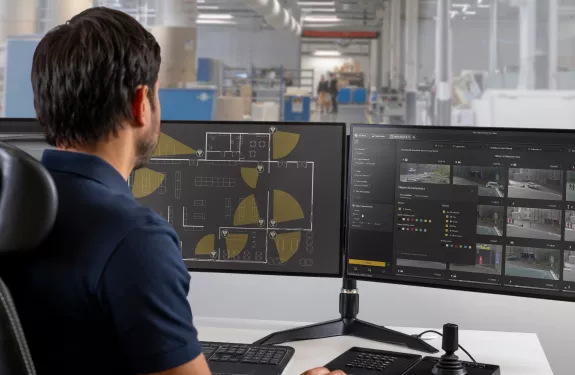 Man at computer using AI search capabilites