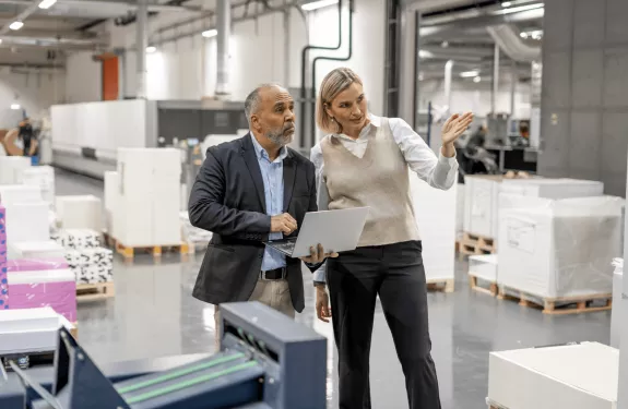 man and women discussing in the workplace