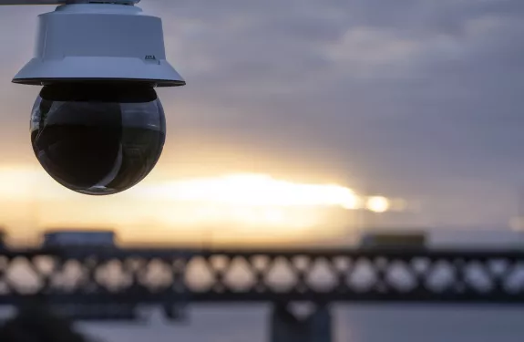 Camera overlooking sea and bridge