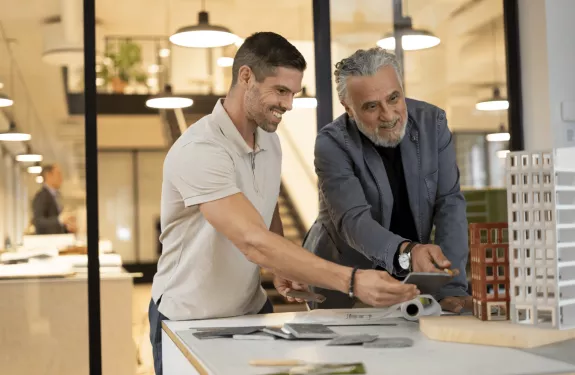 Two men discussing building plans