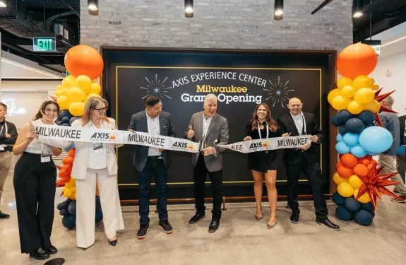 Karl Radke cuts the ribbon to open the Milwaukee AEC