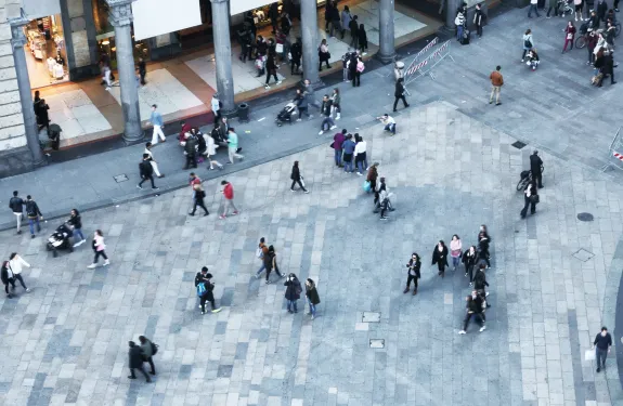 People outdoors walking along streets