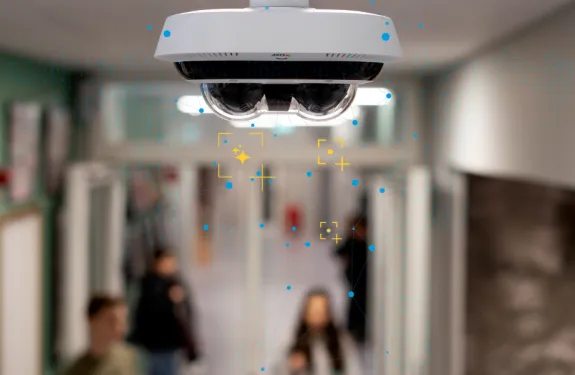 Picture of a camera in a school hallway.