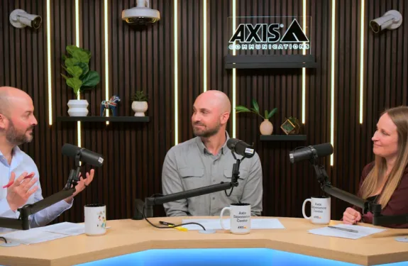 The hosts of Secure Insights, Steve Burdet and Alex Walthers, sit with guest Kelly DeLeo.