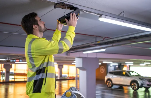 Man installing a camera with PTRZ features