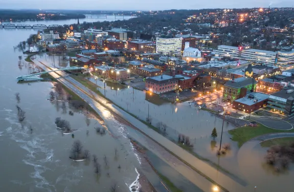 A flooded shoreline next to a city