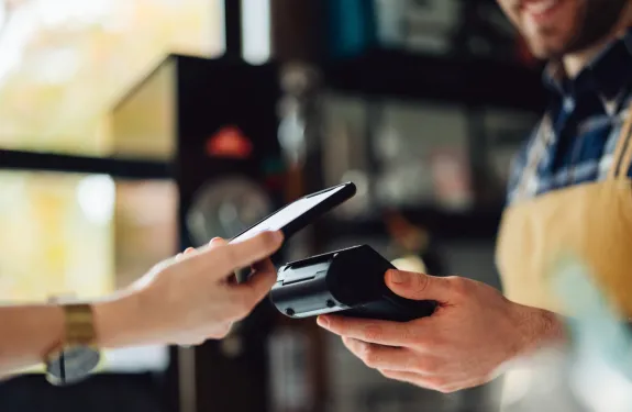 Woman paying with her phone