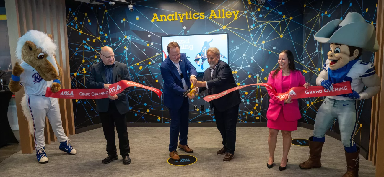 Axis staff and management cutting the ribbon to open the new Dallas-area AEC