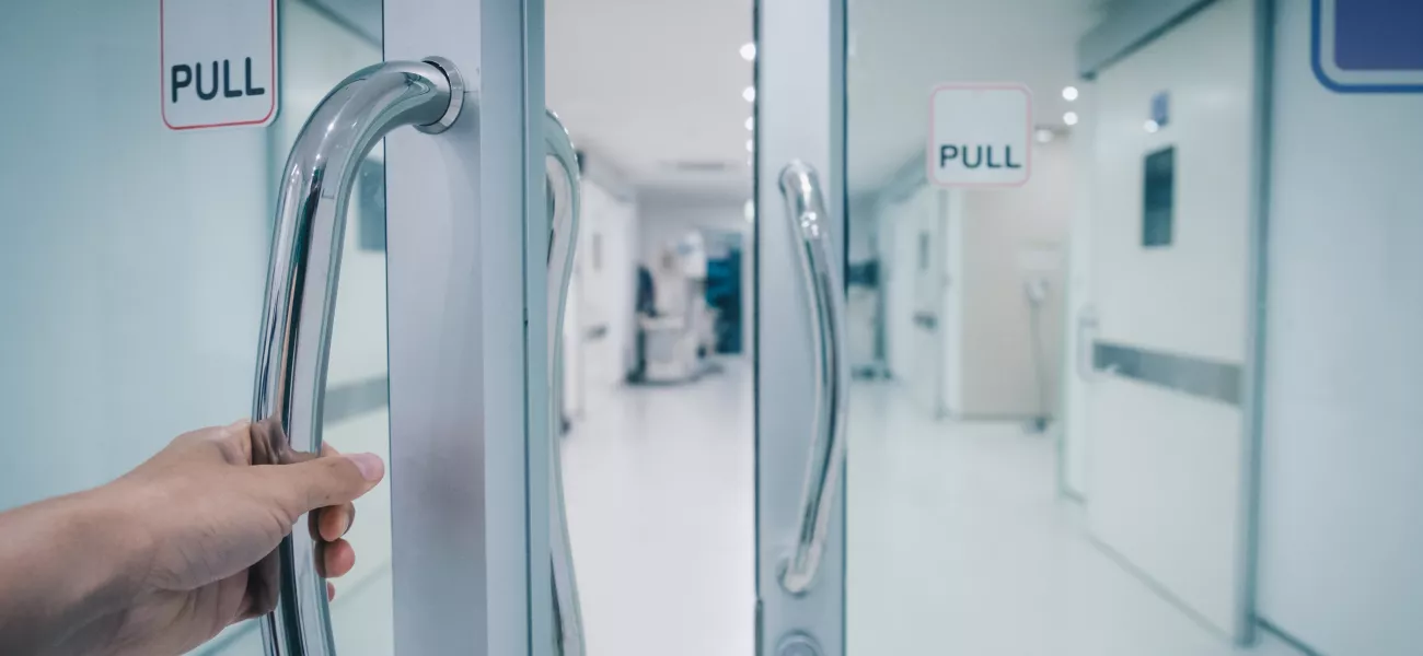 Opening door to hospital cooridor