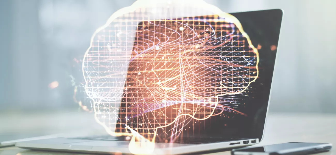 AI Brain in front of laptop