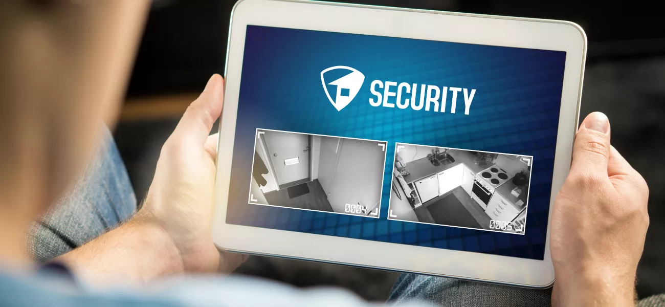 Man holding tablet with security screen