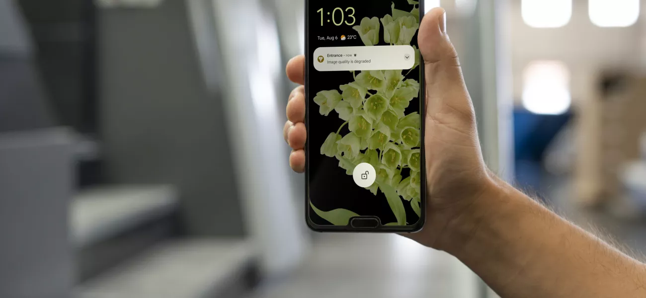 person showing a phone with a notification