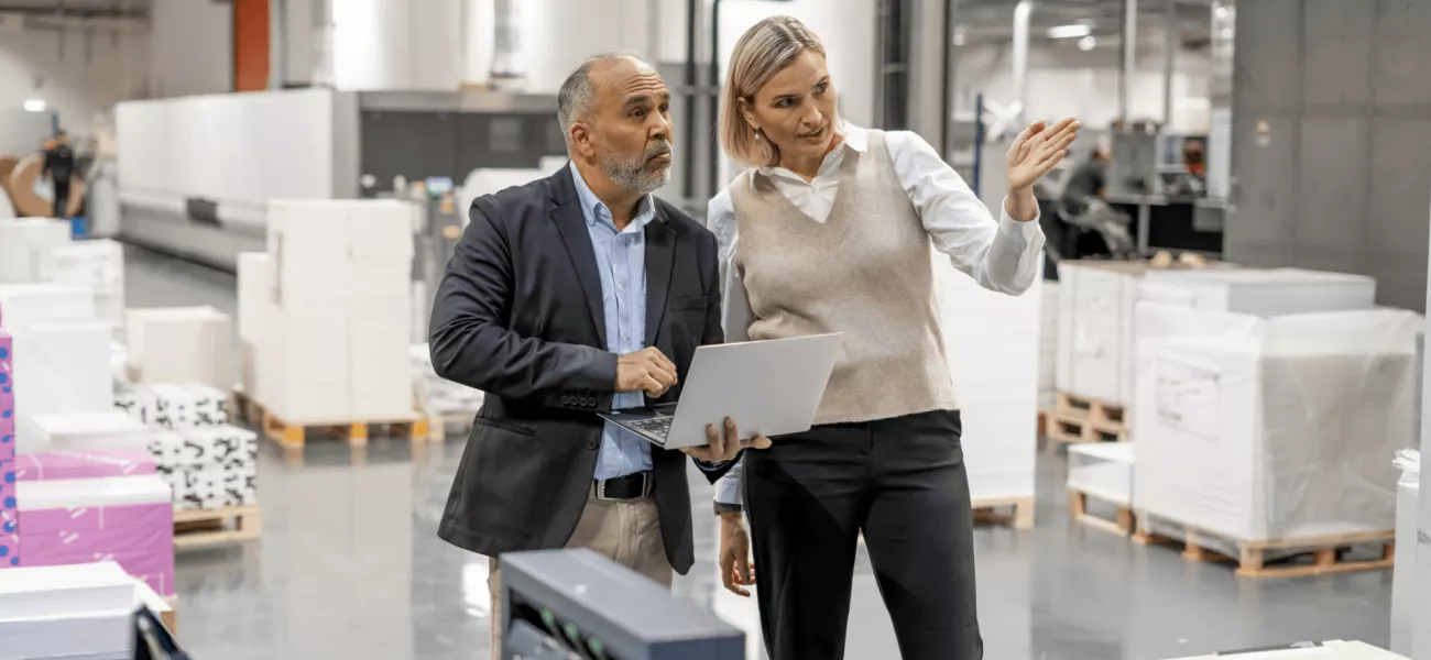 man and women discussing in the workplace