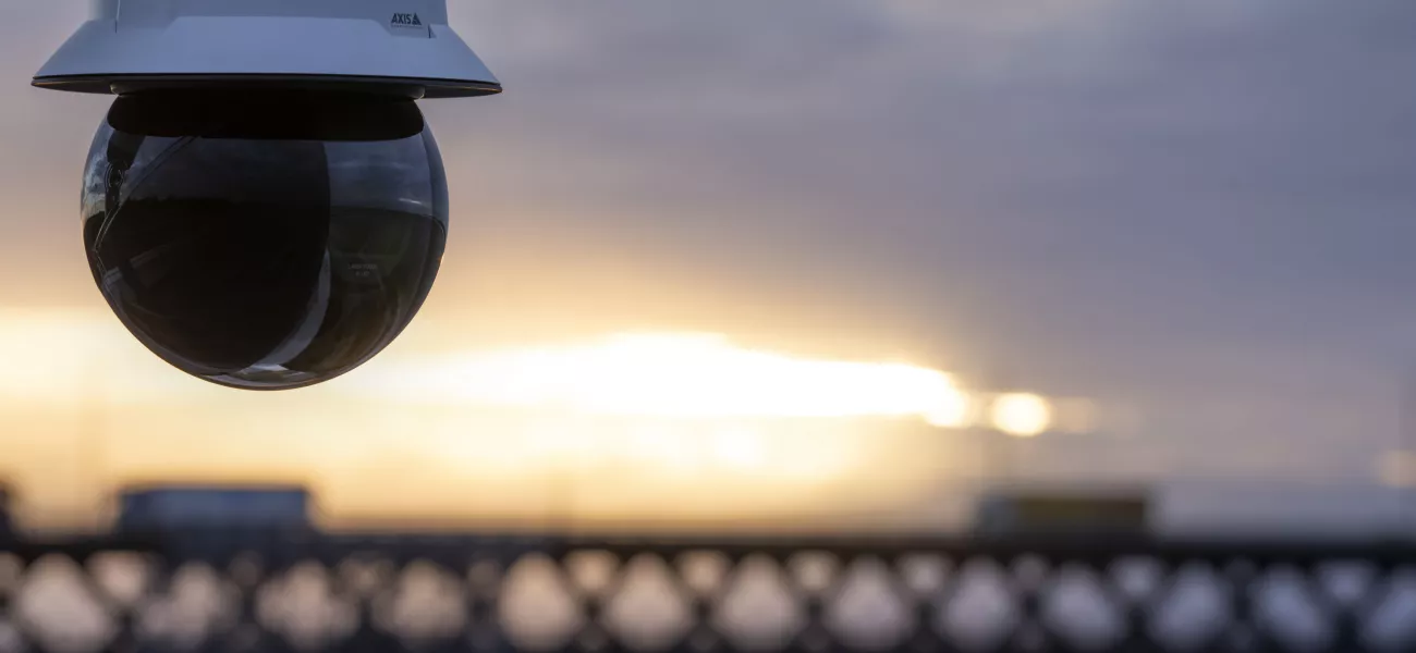 Camera overlooking sea and bridge