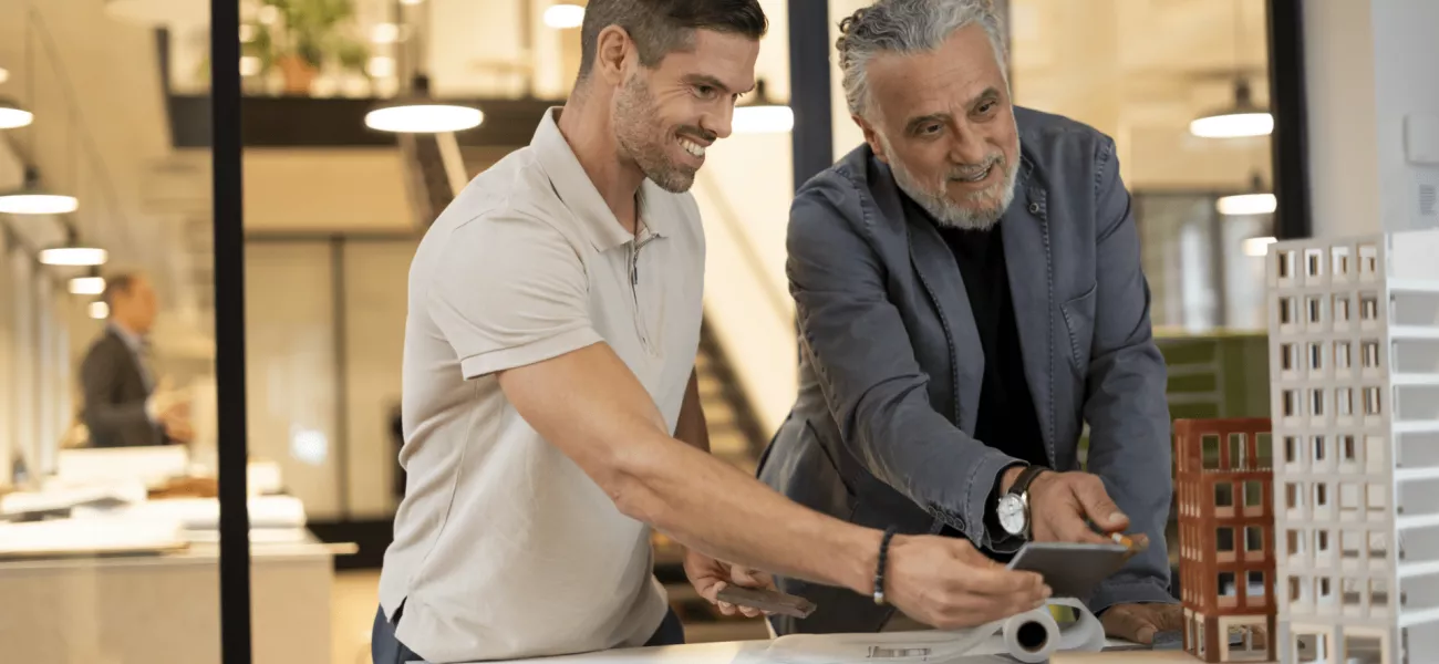 Two men discussing building plans