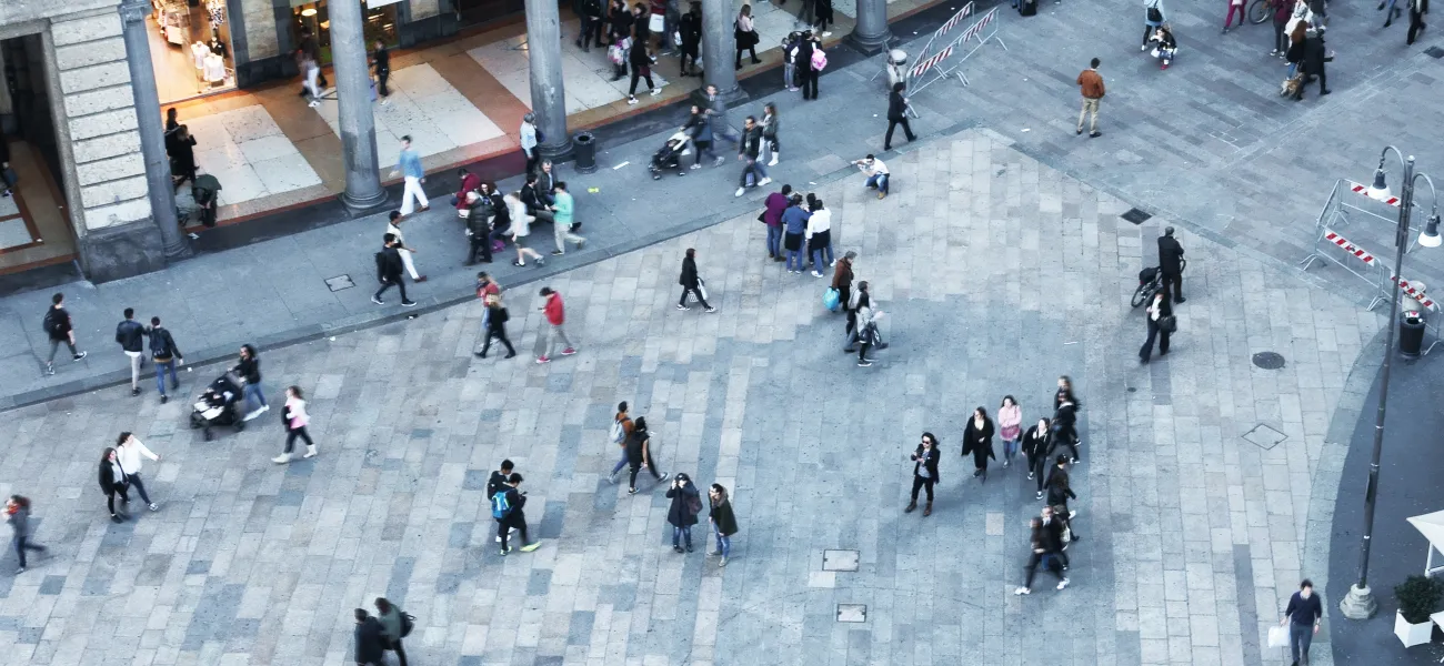 People outdoors walking along streets