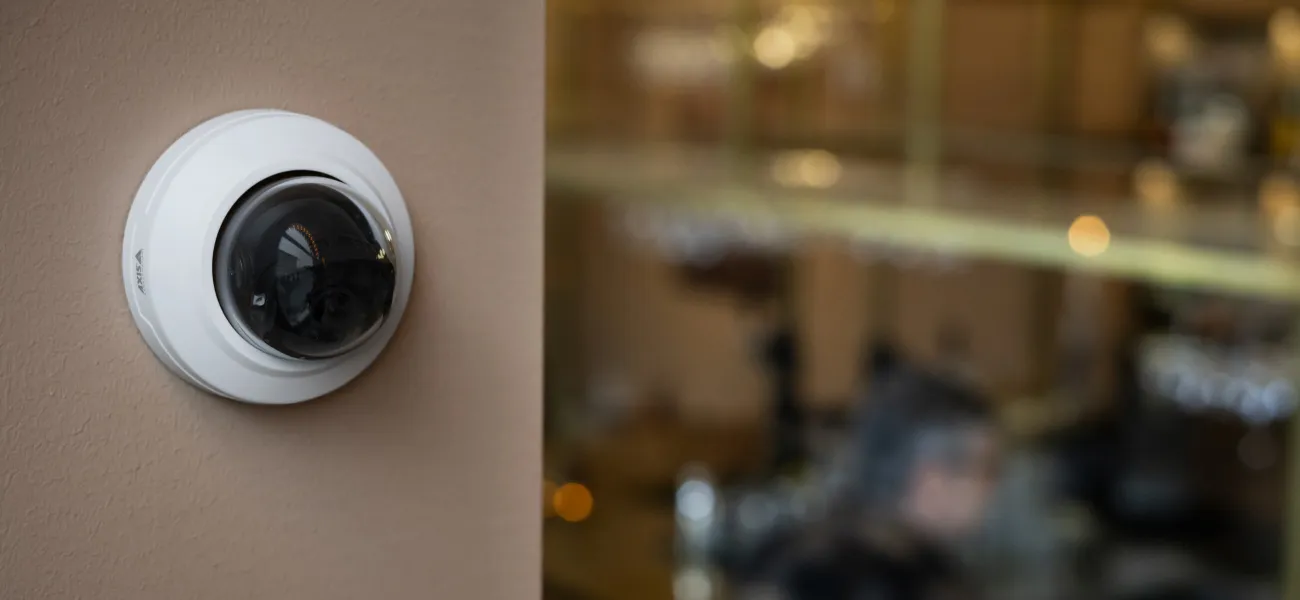 AXIS M3098-LV mounted on a restaurant wall