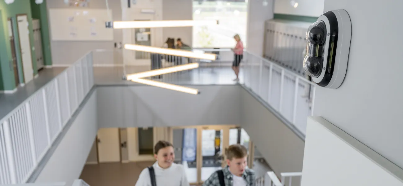 School staircase and hallway with network camera mounted on the wall