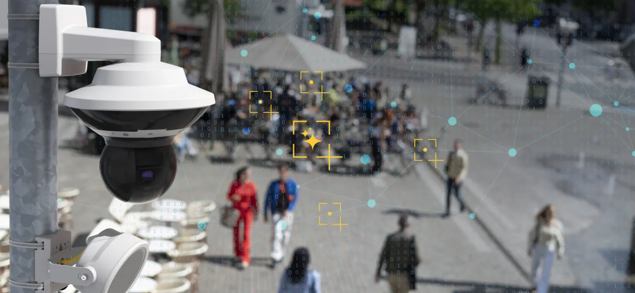 An Axis camera is shown in a busy city with an analytical overlay.