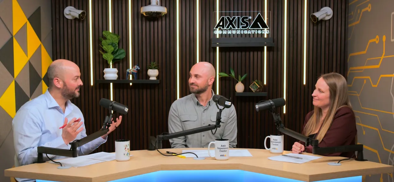 The hosts of Secure Insights, Steve Burdet and Alex Walthers, sit with guest Kelly DeLeo.