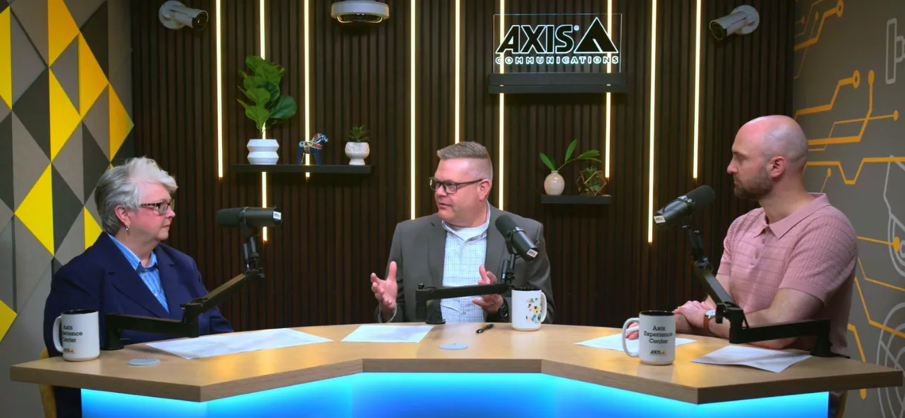 Industry experts discuss modern security during the filming of a podcast.