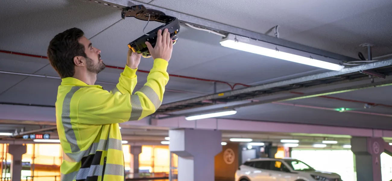 Man installing a camera with PTRZ features