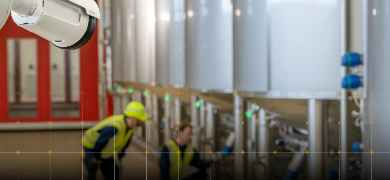 A camera looks on as workers investigate critical machinary.