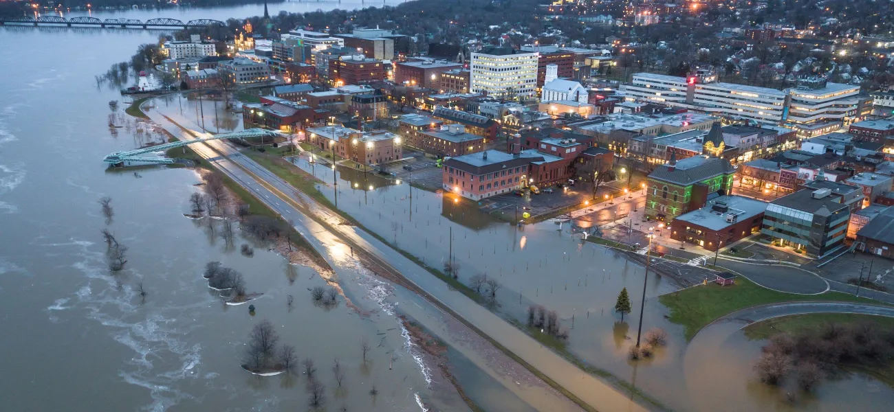 A flooded shoreline next to a city