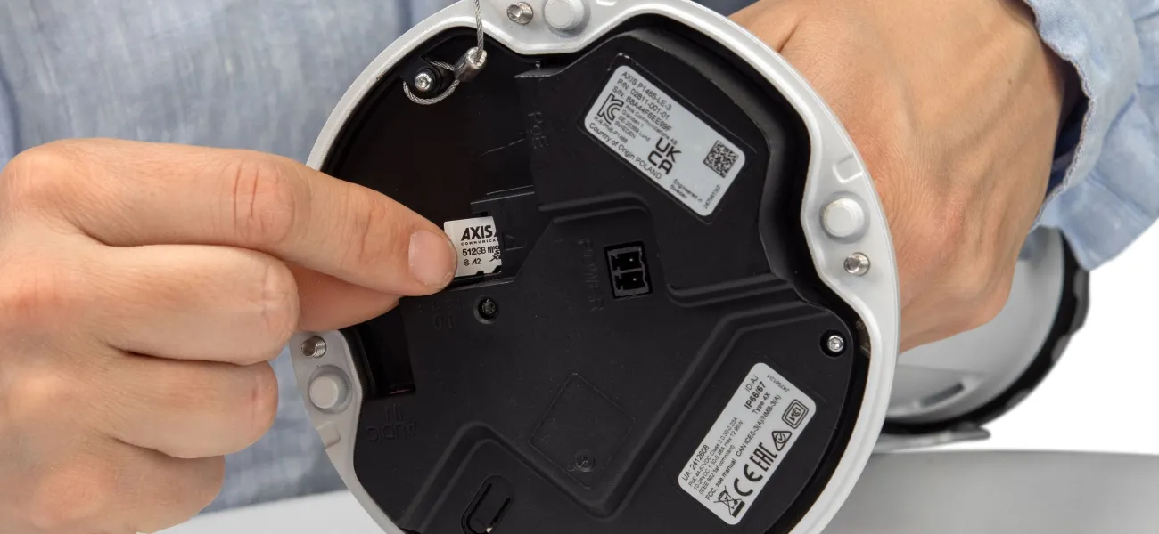 Security camera with an SD card being inserted