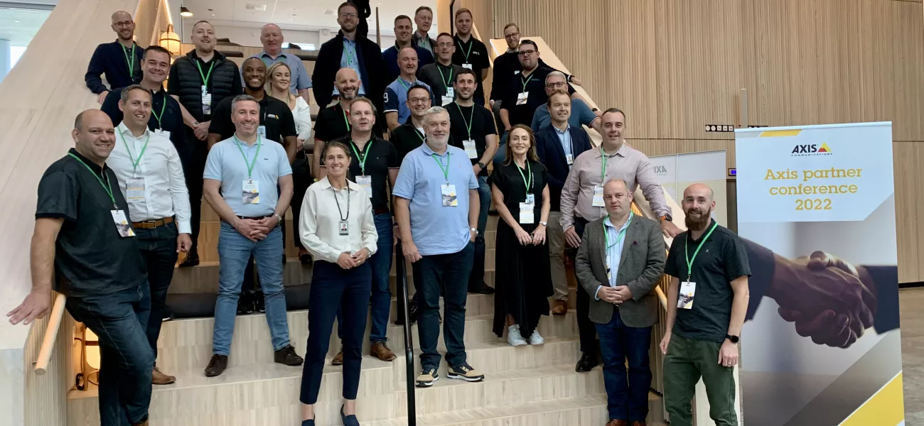 Axis channel partners standing on stairs in HQ