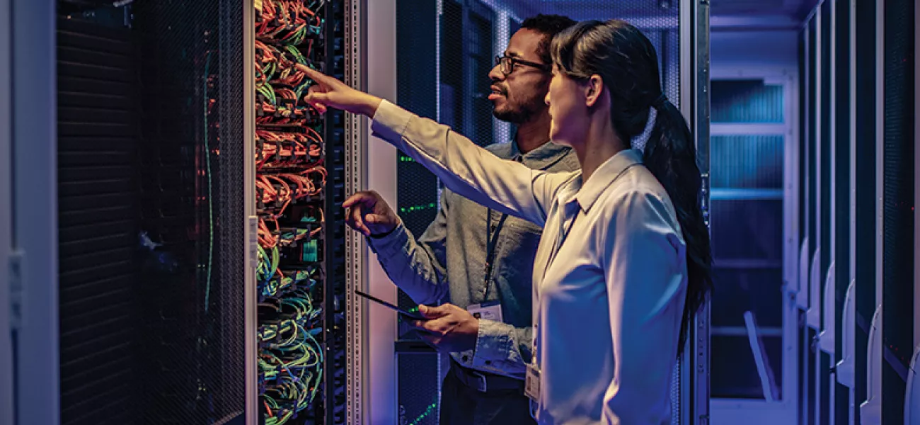 man_woman_pointing_server_racks