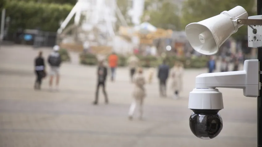 An outdoor public address system including a network camera and network speaker overseeing a city square