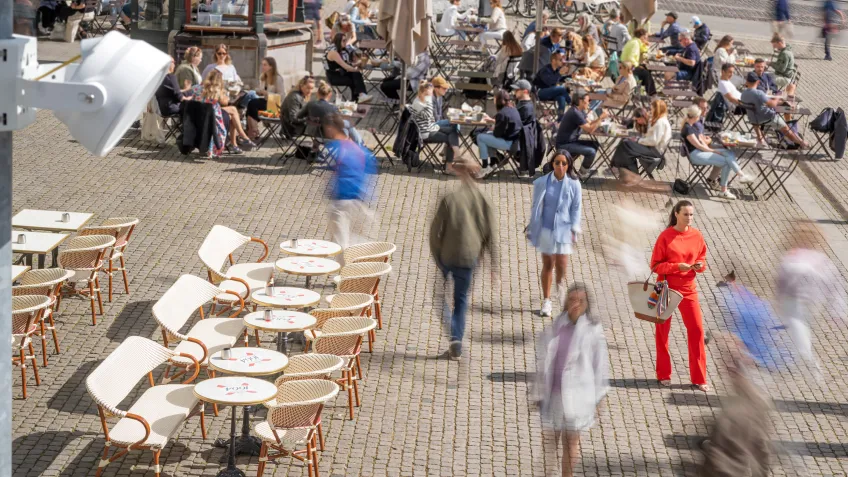 An outdoor network speaker overseeing a city square