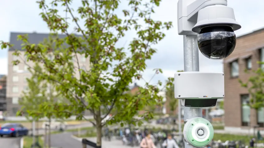 One network camera, a radar and a strobe siren mounted next to a school