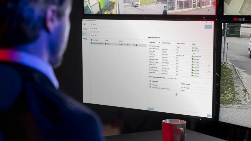 Man in front of screen looking at an audit trail of who accessed the premises