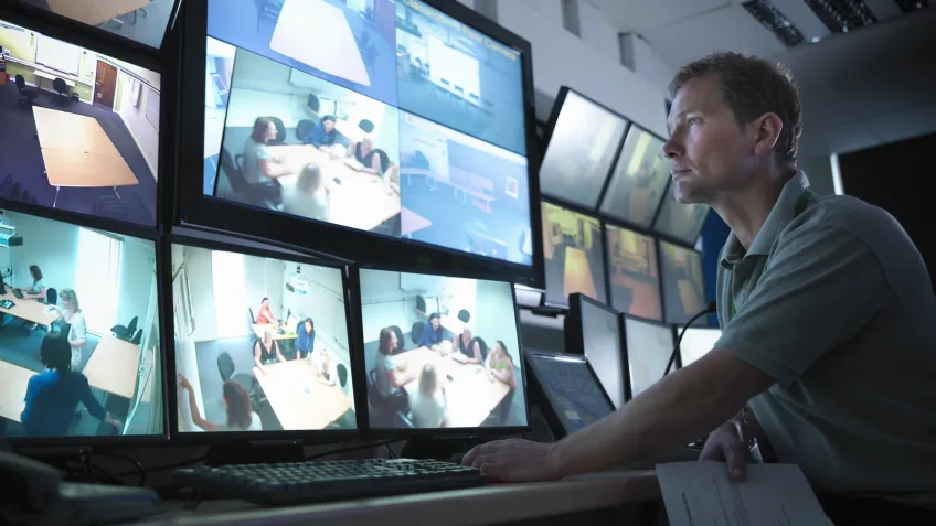 Man watching body worn camera footage as part of his training