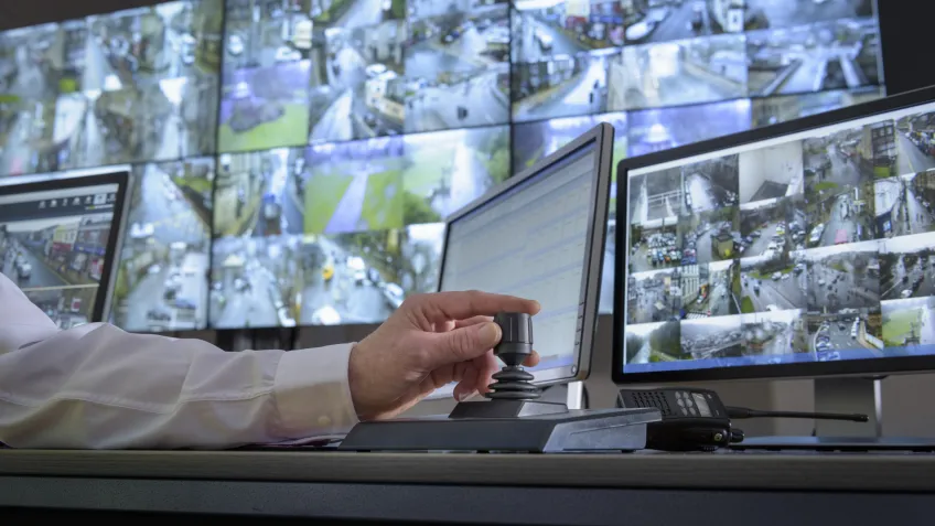 A real time crime center looking at multiple monitors