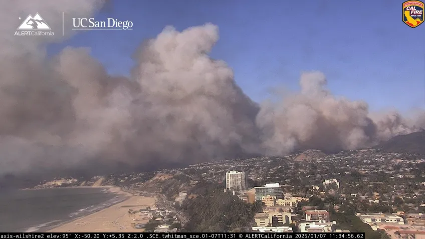A wildfire started close to a city
