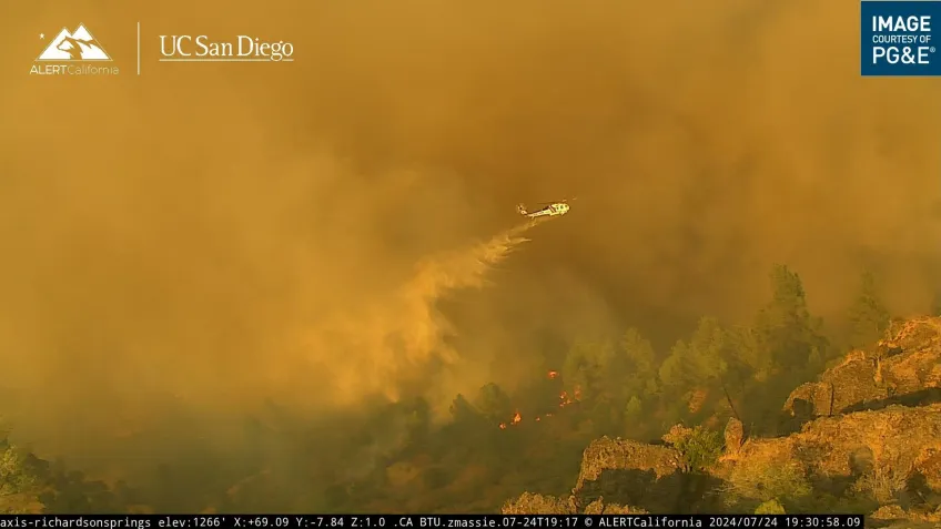 Helicopter helping to extinguish a forest fire